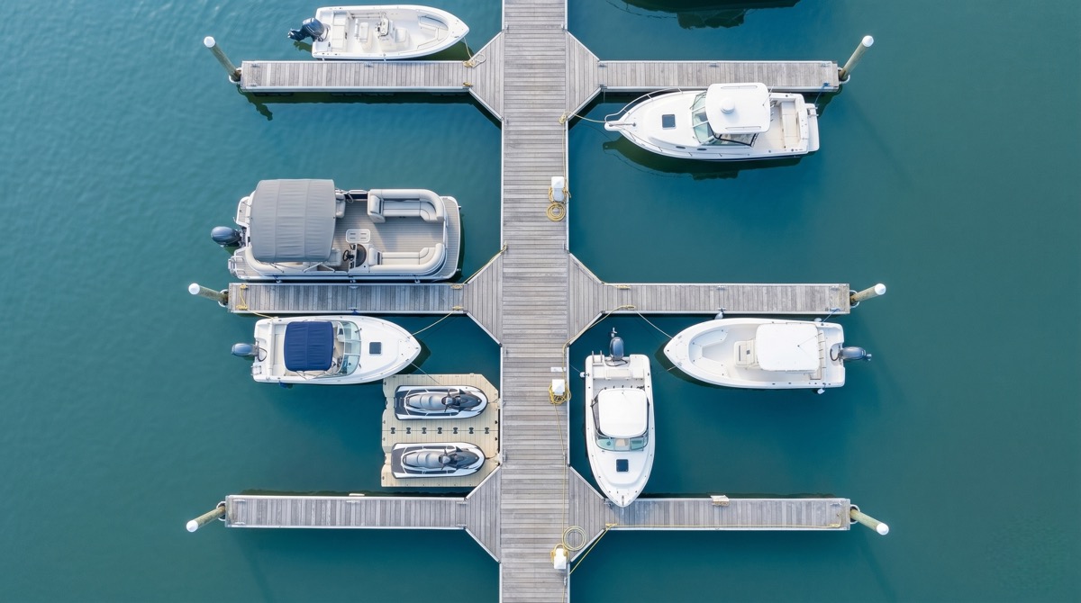 Boat rental operator reviewing maintenance and insurance costs